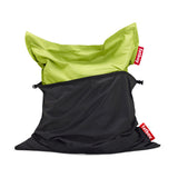 Black water-resistant zip-on protective cover halfway sheathing a lime-green bean bag — The Beanbag Cover-up by Fatboy