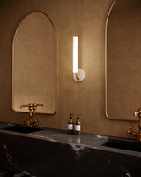 Vintage Brass/Travertine Wick Wall Sconce by Kuzco Lighting in Bathroom