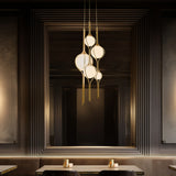 Vintage Brass Skyla Multi-Light Suspension by Modern Forms in Dining Area