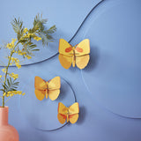 Yellow Butterflies Wall Art, Set of 3, styled in an interior