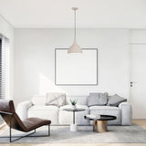 Zoe Ceramic Pendant Light by Geo Contemporary in White hanging in a bright living room with a white sofa