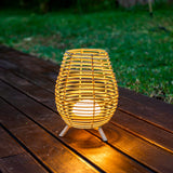 Bossa Portable Table Lamp - lit on a garden deck