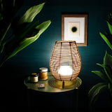Bossa Portable Table Lamp - lit on a side table