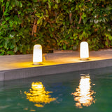 Candy Portable Table Lamp - a pair by a pool