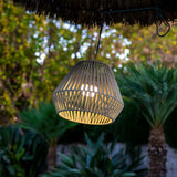 Conta Portable Pendant Light - Taupe, hanging from a canopy