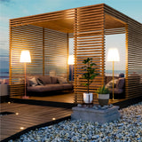Lola Slim Floor Lamp - Brass and Pink Gold, on a terrace