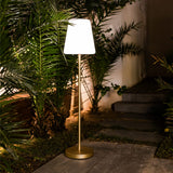 Lola Slim Floor Lamp - lit in a garden