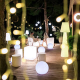 Lola Floor Lamp - 3000K, on a terrace, wide view