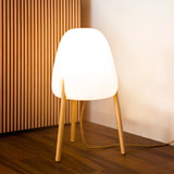 Rocket Floor Lamp - Small, lit in a living room