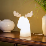Rudy Reindeer Table Lamp - Plug In, lit on a console