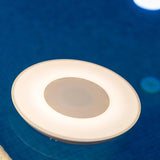 Wally Play Disk Floating Speaker Light - lit on the water