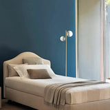 Natural Brass Molecola Floor Lamp in Bedroom