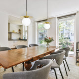 Arenales Pendant Light By Eglo - Brass Color above the dining table