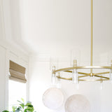 Tabitha Chandelier By Mitzi - Aged Brass Hanging near Window