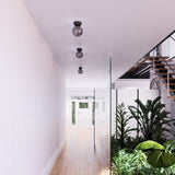 Arcadia Ceiling Light by Kuzco - Black/Smoked in corridor