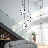 Aries 3-Light Chandelier by Kuzco - Black hanging above on sofa