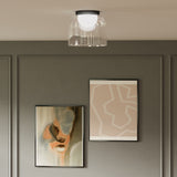 Cedar Ceiling Light by Kuzco - Tall, Black hanging on white canopy