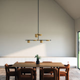 Jayden Chandelier by Kuzco - Black/Brushed Gold, Hanging above on table