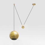 Brass Nur Reversed counterbalance weight Pendant Light by Dounia Home