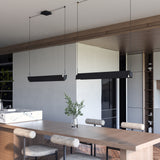 Phoenix Linear Suspension By Kuzco - Black/White Suspension Hanging Above the Table