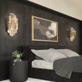 Rowland Vanity Light By Alora - Titanium Gold Color on the wall near the bed