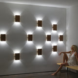 Tersus Wood Wall Sconce in living room