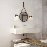 Pluto Wall Sconce in Bathroom