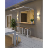 Acuo Outdoor Wall Sconce by Cerno - Textured White, on an outdoor patio wall beside a kitchen pass-through