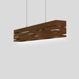Aeris 54 Linear Pendant by Cerno in walnut, angled view showing the cut slits and glowing underside