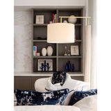 Altus Floor Lamp by Cerno with a White Linen shade beside a sofa and bookshelf