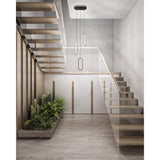 Atom Cluster Pendant by Dals hung over a dining table