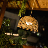 Bossa Portable Pendant Light - lit under a pergola