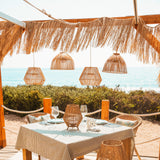 Bossa Portable Pendant Light - over a beach dining table