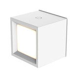 Box wall-mounted rechargeable lamp by New Garden, white cube with a warm-glowing recessed square face and touch control on top