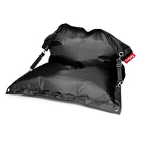 Black weather-resistant outdoor bean bag in ripstop fabric with adjustable straps, metal eyelets, and red Fatboy tab — Buggle-up Bean Bag by Fatboy