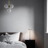 Brass/Opal Miira 4 Pendant Light by Nuura in Bedroom