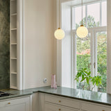 Brushed Brass/Opal Large Apiales Single Pendant Light by Nuura in Kitchen