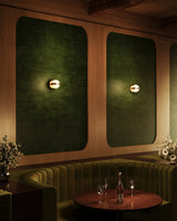 Brushed Gold Selene Wall Sconce by Kuzco Lighting in Restaurant