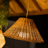 Calobra Portable Pendant Light - lit under a wooden roof