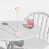 Cheerio Table Lamp - Soft Pink, on a bistro table