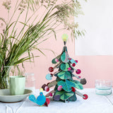 Peacock Tabletop Christmas Tree, styled in an interior