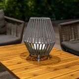Conta Portable Lamp - Small, on an outdoor table