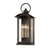 Chaplin Wall Sconce by Troy Lighting in Vintage Bronze, 3-Light clear-glass harbor lantern