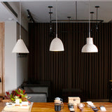 Concrete Gray Castle Bell Pendant by Seed Design in Dining Area