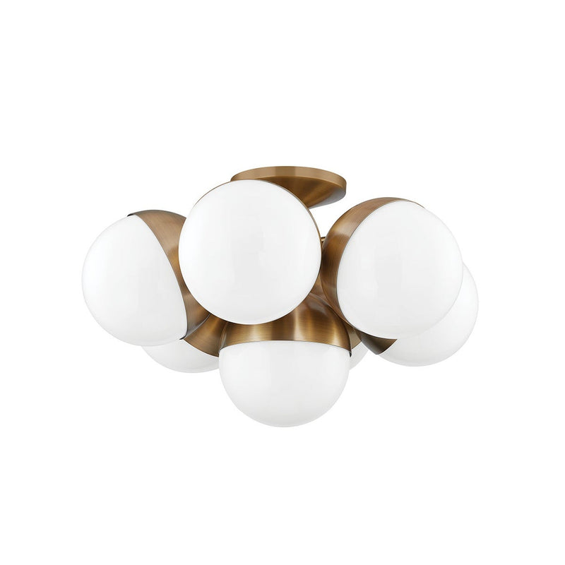 Cupertino Semi Flush by Troy Lighting in Patina Brass, seven opal-white glass globes in a brass cradle