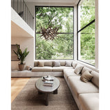Cura Pendant Light by Cerno lifestyle - raw walnut nest pendant in a double-height living room