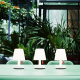 Edison The Mini Table Lamp (Set of 3) - on an outdoor table among plants