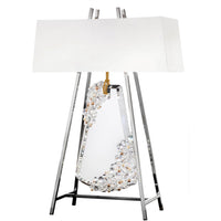 Decorative table lamp with crystal base and white shade on a white background