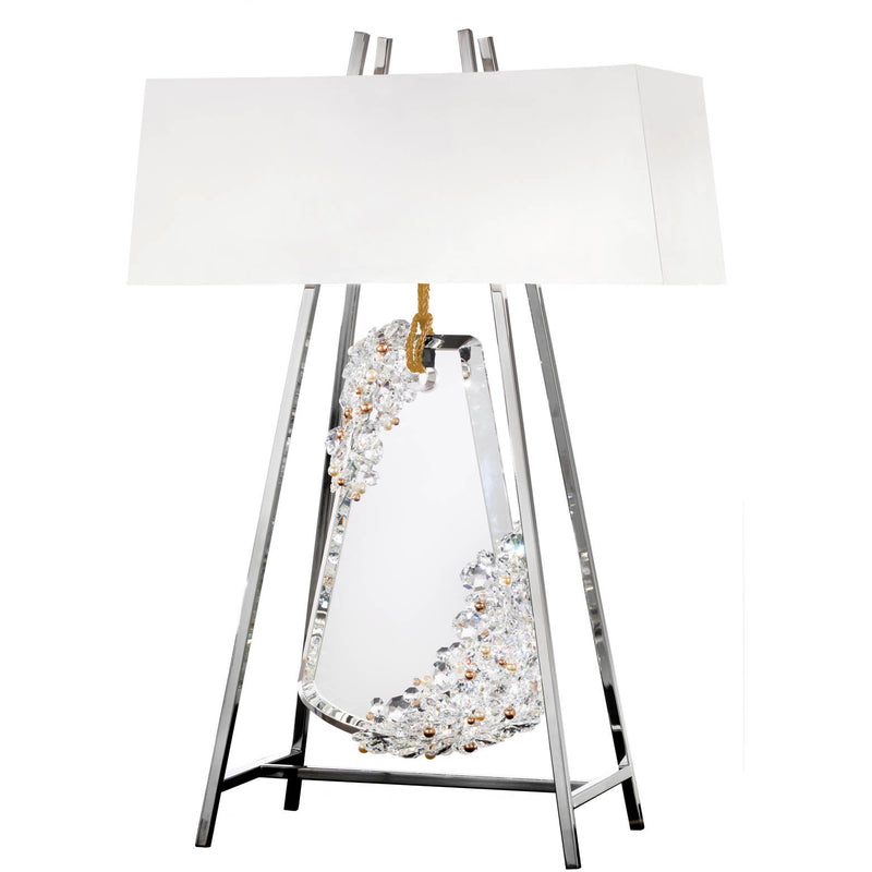 Decorative table lamp with crystal base and white shade on a white background