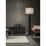 Forma Floor Lamp by Cerno with a linen shade beside a sideboard